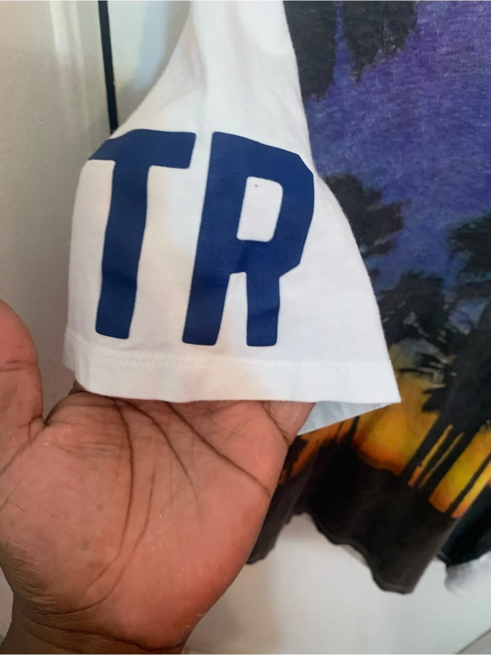 True Religion Men’s White-Rim Graphic Tee with Black and Purple Print